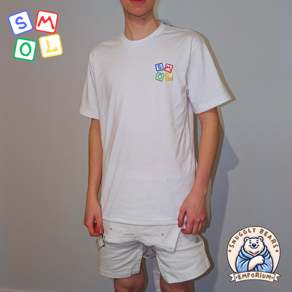 Boy wearing a white SMOL branded t-shirt