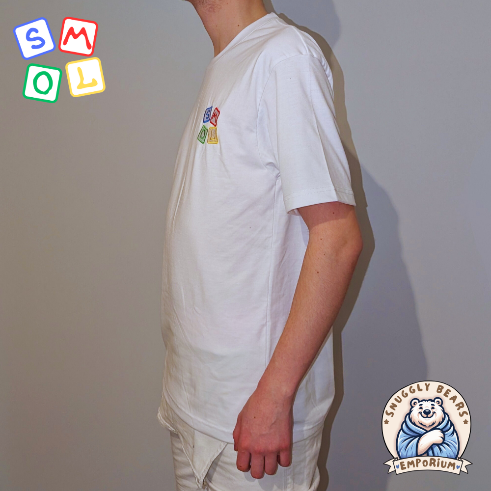 Boy wearing a white SMOL branded t-shirt