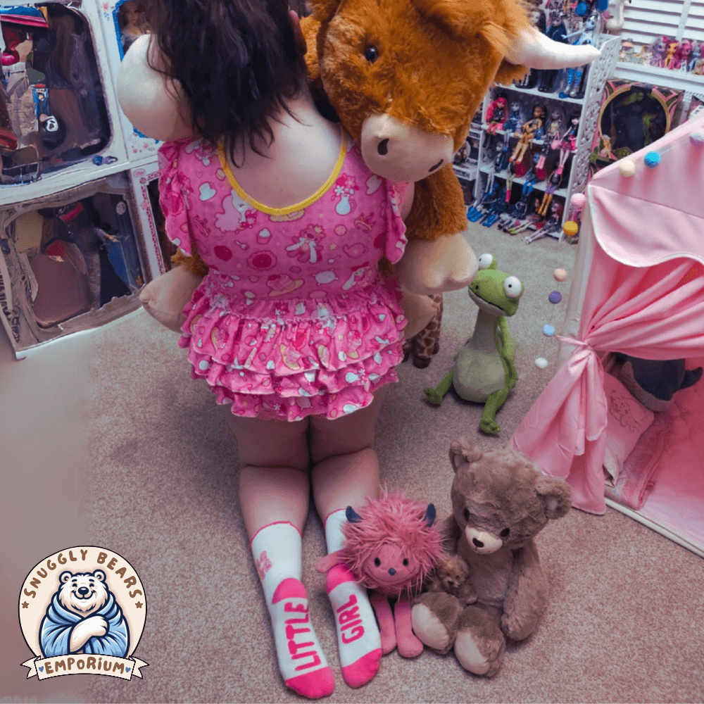 Two girls wearing, SMOL Little Girl ABDL Socks with pink accents, ruffled edges, and playful lettering for a cute and comfy look.